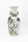 A Chinese Qianjiang decorated porcelain vase with a decor of two herons in nature