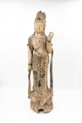 A large and Chinese patinated carved wood figural sculpture of Guanyin
