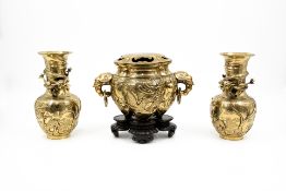 An antique and oriëntal pair of polished bronze vases, together with a matching incense burner