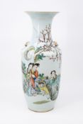 A Chinese Qianjiang cai decorated porcelain vase with scene of ladies in the garden