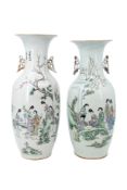 A lot of two Chinese Qianjiang cai porcelain vases, variously decorated with ladies