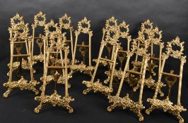 20th Century English School. A Set of Fourteen Brass Picture Stands, height 13
