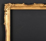 20th Century English School. A Gilt Composition Frame with swept centres and corners, rebate 17