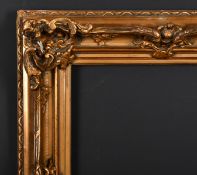 20th Century European School. A Gilt Composition Frame with swept and pierced centres and corners,