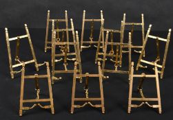 20th Century English School. A Set of Twelve Brass Picture Stands, height 6