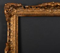 20th Century English School. A Gilt Composition Frame, with swept and pierced centres and corners,