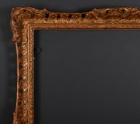 20th Century English School. A Gilt Composition Frame with swept and pierced centres and corners,