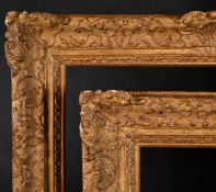 18th Century French School. A Fine Pair of Louis XIV Carved Giltwood Frames with swept centres and