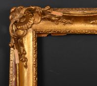 20th Century European School. A Gilt Composition Frame with swept and pierced corners, rebate 9