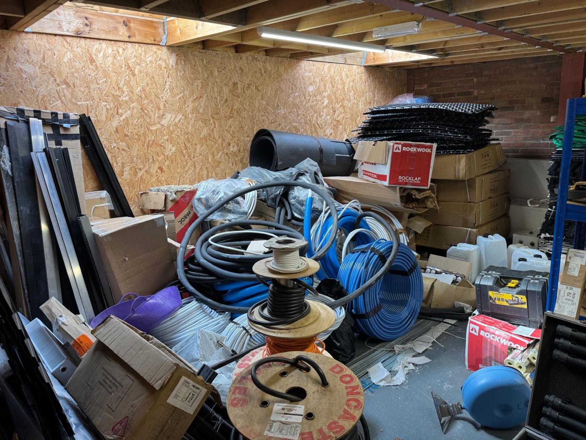 Entire Contents of Rear Storeroom Comprising: Slotted Steel Shelving, Plastic Tubing, Procrate V2,