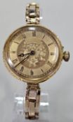 18ct gold fancy fob watch with engine turned Roman face and foliate outer case, now converted to a