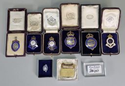 John Pinches London, a collection of three cased Royal Agricultural Society of England badges with