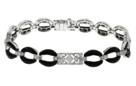 Armband 17,13g 750/- Weißgold mit 71 Diamanten zus. ca. 1,20 ct. F/vs und Onyx, Länge ca. 18,50 cm