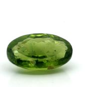 Peridot Oval zu 7.27 ct.. Laenge 15.11 mm. Breite 10.11 mm. Hoehe 6.03 mm