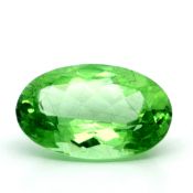 Peridot zu 9.49 ct.. Laenge 17.28 mm. Breite 11.40 mm. Hoehe 7.07 mm