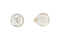 Paire de clous d'oreilles 2 ors 750 sertis de diamants taille ancienne (env. 0.7 ct chacun)