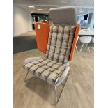Contemporary upholstered breakout winged Armchair, with chrome legs, orange (location in building: