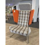 Contemporary upholstered breakout winged Armchair, with chrome legs, orange (location in building: