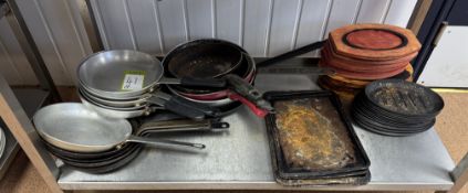Quantity Frying Pans, etc, to shelf (location in building: first floor)