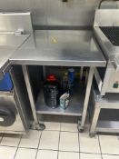 Mobile stainless steel table with under shelf 60cm x 70cm x 80cm Note this lot has a lift out charge