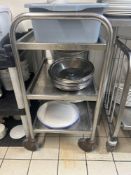 Stainless steel mobile hostess trolley and contents and 3 tier plastic rack Note this lot has a lift