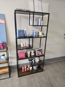 Asymmetrical bookcase or display étagère featuring a sculptural open-shelf design with staggered