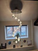 Modern chandelier pendant featuring a circular ceiling plate with 14 suspended LED droplights in