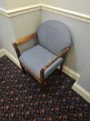 Country-Style Benchairs armchair with rounded backrest and polished wooden armrests and legs.