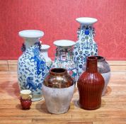 A diverse collection of nine decorative vases showcasing a blend of traditional Chinese and Japanese
