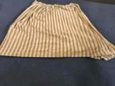 A Single Panel Drape Features Alternating Vertical Bands Of Light Beige/Cream And A Darker Tan/Brown