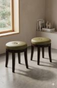 A pair of Decca Carolina stools with compact circular forms, round button tufted seats in light sage
