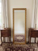 Gold Framed Bevelled Dress Mirror: A tall bevelled mirror framed in carved gold with bead detailing,