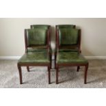 A set of four mahogany side chairs is upholstered in green leather across the seats and backrests,