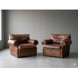 Pair of Ralph Lauren Wentworth armchairs is upholstered in saddle tan brown leather. The design