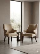 A pair of Decca Lounge Chairs identical pair of Decca lounge chairs with a transitional barrel