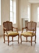 Pair of Louis XIV Style Amand Armchairs: A pair of Louis XIV style Amand armchairs inspired by