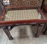 Edwardian-style mahogany bijouterie table features a rectangular top with a recessed glass display