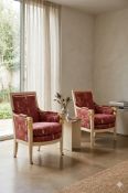 Pair of Empire Style Pluvinet Bergères A dramatic pair of Directoire style bergères with