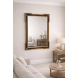 A rectangular walnut-framed accent mirror of Neoclassical influence, featuring a deep wood-grain