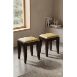 Pair of Decca Transitional Stools A pair of transitional stools with champagne leather seats