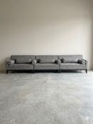 Large Modern Sectional Sofa: A three section modern grey textured fabric sofa with individual back