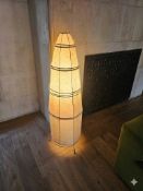 Caravane Paris  Bell floor lamp combines a handcrafted plant shade with a metal structure with clean