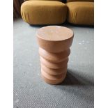 HKLiving Stoneware Side Table is a bold, sculptural piece that bridges the gap between functional