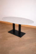 Ovoid dining table (140 x 80 x 77cm) offers a sophisticated marriage of durable industrial design