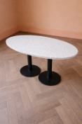 Ovoid Terrazzo Dining Table contemporary dining table features a minimalist design with a focus on
