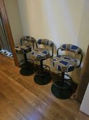 A pair bar stools These stools feature a heavy-duty, industrial-style metal frame finished in a deep