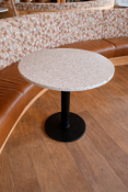 Circular dining table (65 x 77cm) offers a sophisticated marriage of durable industrial design and