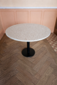 Circular dining table (71 x 72cm) offers a sophisticated marriage of durable industrial design and