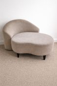 Nordic mini curved contemporary sofa upholstered in a neutral taupe velvet-textured fabric. The