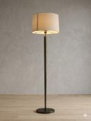 Numirra floor standard lamp in an antique brass finish, featuring a tall, slender tapered stem